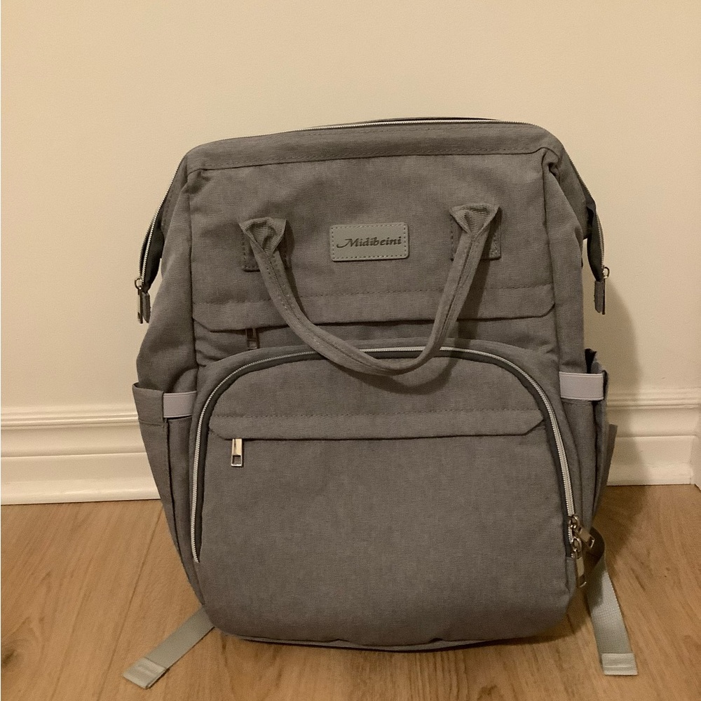 Midibeini Diaper Bag with built in changing station and mosquito net